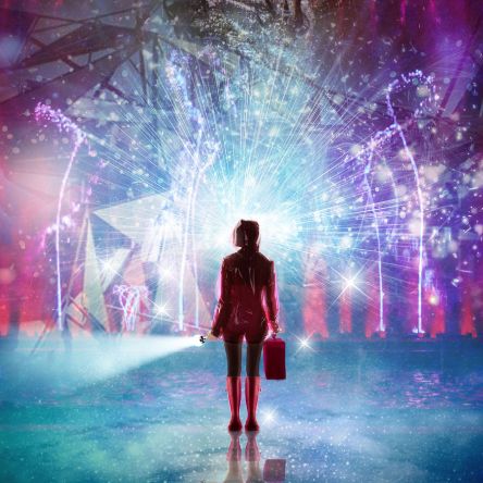 Silhouette of a person holding a suitcase and flashlight, standing before a radiant burst of light and geometric projections in a vibrant, immersive scene.