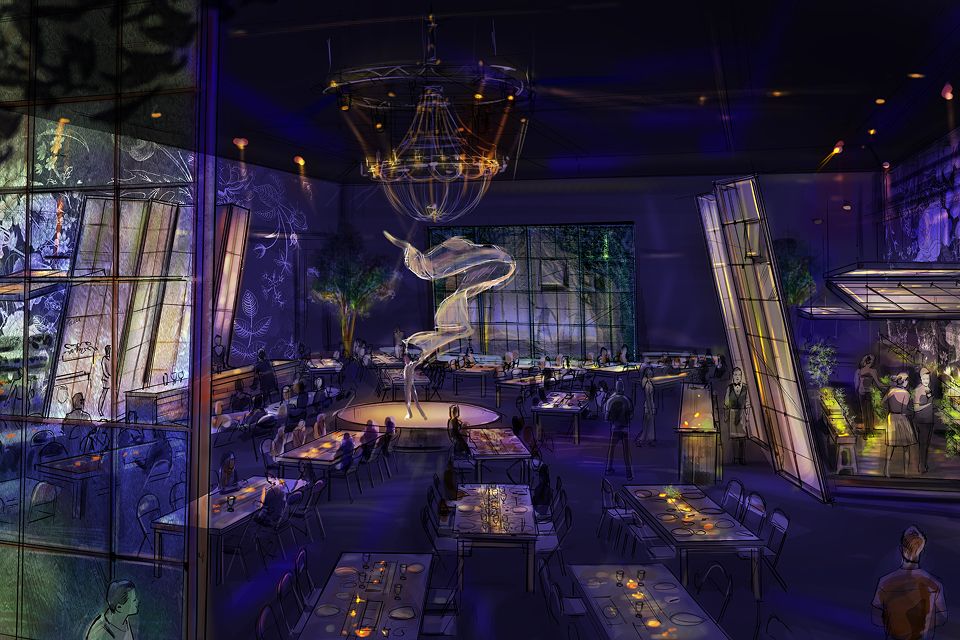 Wide view of an immersive Cirque du Soleil dining venue with suspended sculptures, atmospheric lighting, and elegantly set tables.